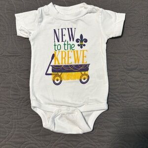 "New to the Krewe" White Baby Onesie with Mardi Gras Graphic